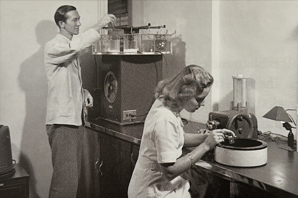 Raymond and a lab tech, circa 1940